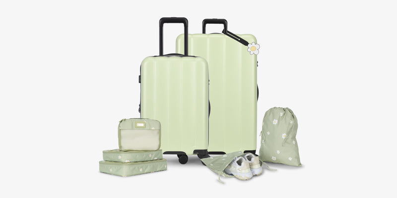 CALPAK Evry Starter Bundle in light green Daisy that includes: Evry Large Luggage, Evry Carry On Luggage, light green with Daisy patterned Packing Cubes and Shoe Bag