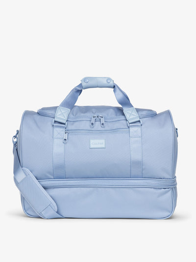 CALPAK Stevyn Duffel bag with removeable crossbody strap in sky; DST7019-SKY view 1